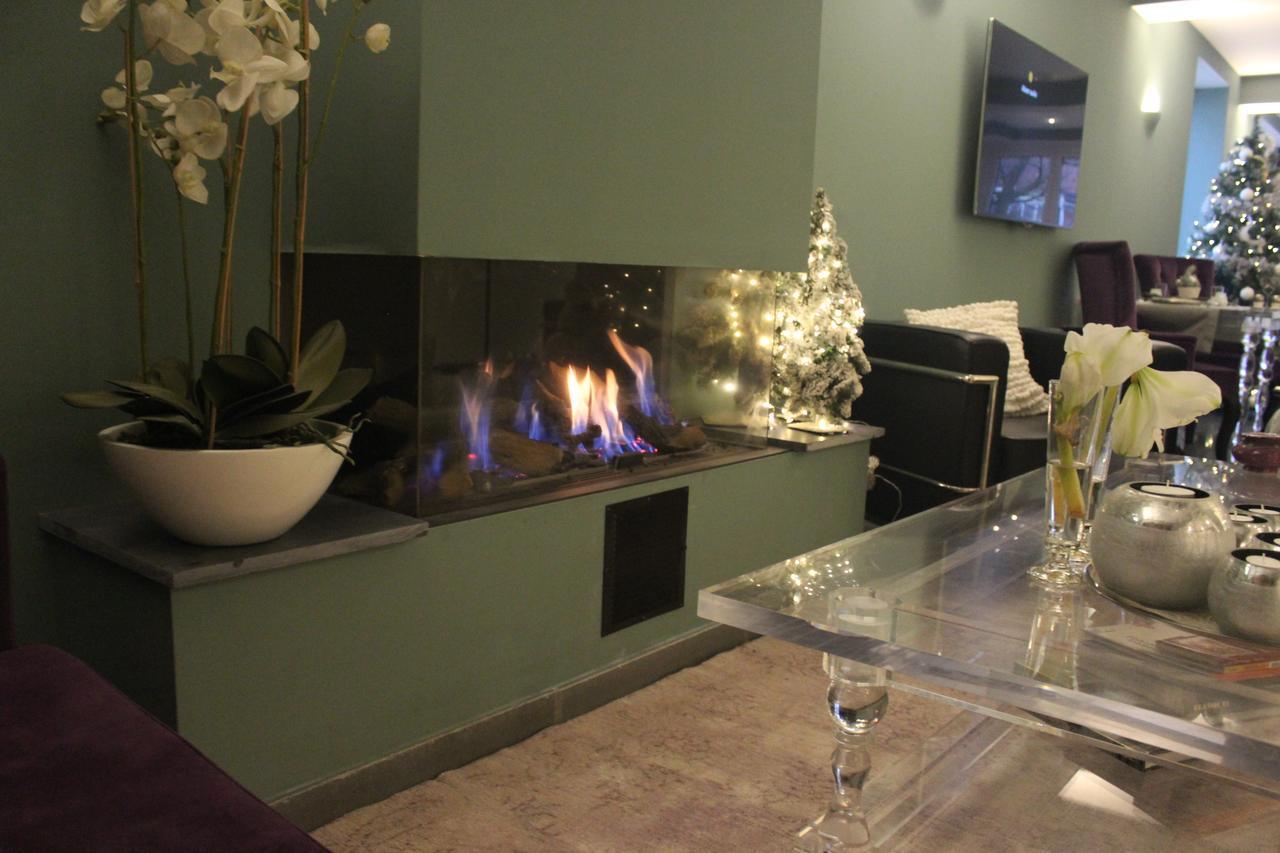 圣乔治住宿加早餐旅馆 布鲁日 外观 照片 A fireplace in the lobby of the hotel